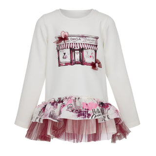 White long-sleeve top with a printed top and 'DAGA' branding on a white background