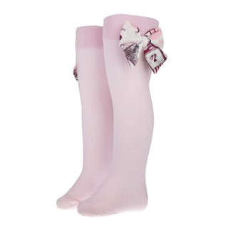Pink knee-high socks with a decorative bow on a white background by Daga
