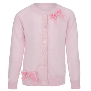 Pink knit cardigan by Daga for girls it has a pink velvet bow on the collar and button up front