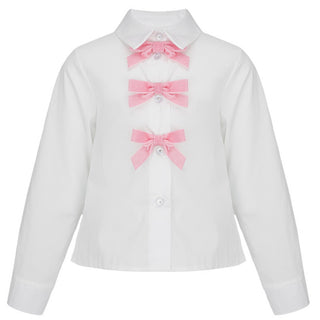 White long sleeve shirt by Daga for girls it is button up front with pink velvet bows up the front