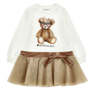 Monnalisa cream long sleeve dress it has a teddy bear design in rhinestones on the front with the Monnalisa logo underneath. The waistband has a velvet bow with a tulle trim  