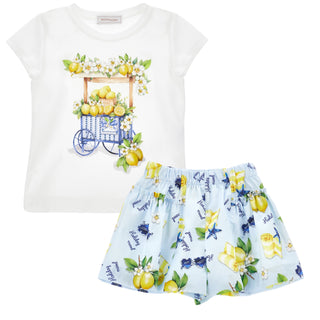 White t-shirt with lemon cart design and matching skirt on a white background