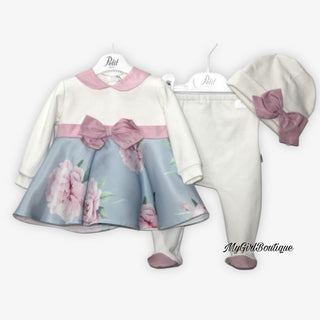 Blue and pink baby grow two piece with pink flowers design it has a satin bow across the front and pink collar and feet. It is matched with a white hat with  a pink satin bow on the front