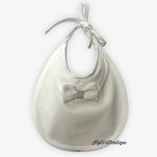 baby boys white bib with a bow tie design and lace up fastening