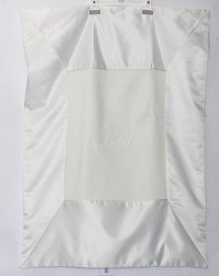 White silk blanket with the petit logo in the middle in white