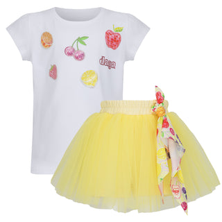 White t-shirt with fruit designs and a yellow tutu skirt with floral accents on a white background