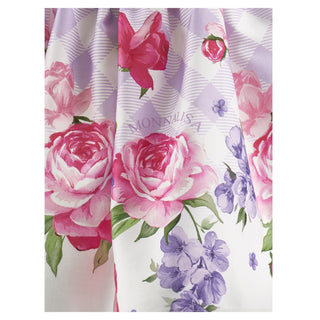Detail of pink and purple floral print on Monnalisa skirt.