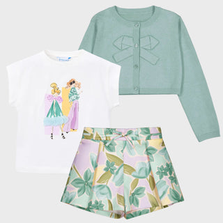 Children's outfit with a white t-shirt, green cardigan, and leaf-patterned shorts on a light gray background.