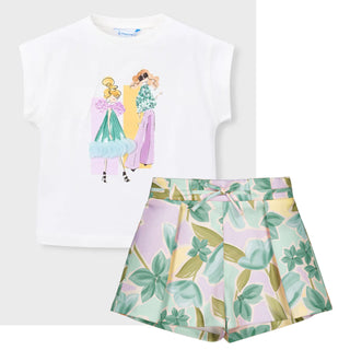 White t-shirt with cartoon design and floral skirt on a white background