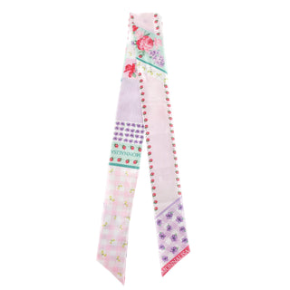 Decorative ribbon with floral and polka dot patterns on a white background