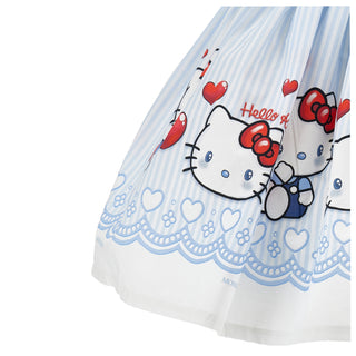 White dress with Hello Kitty design featuring red bows and blue accents on a white background
