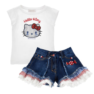 White Monnalisa t-shirt with Hello Kitty design and denim shorts with ruffled hem on a white background