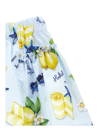 White garment with lemon and floral pattern on a white background