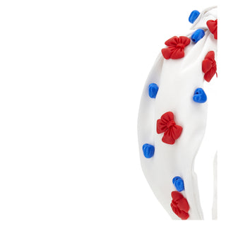 White headband with red and blue bow decorations on a white background